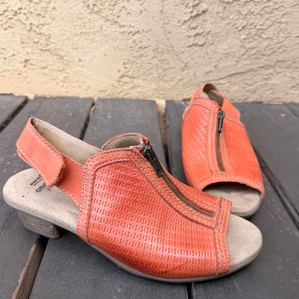 Orange leather wedge heel sandals with zipper detail